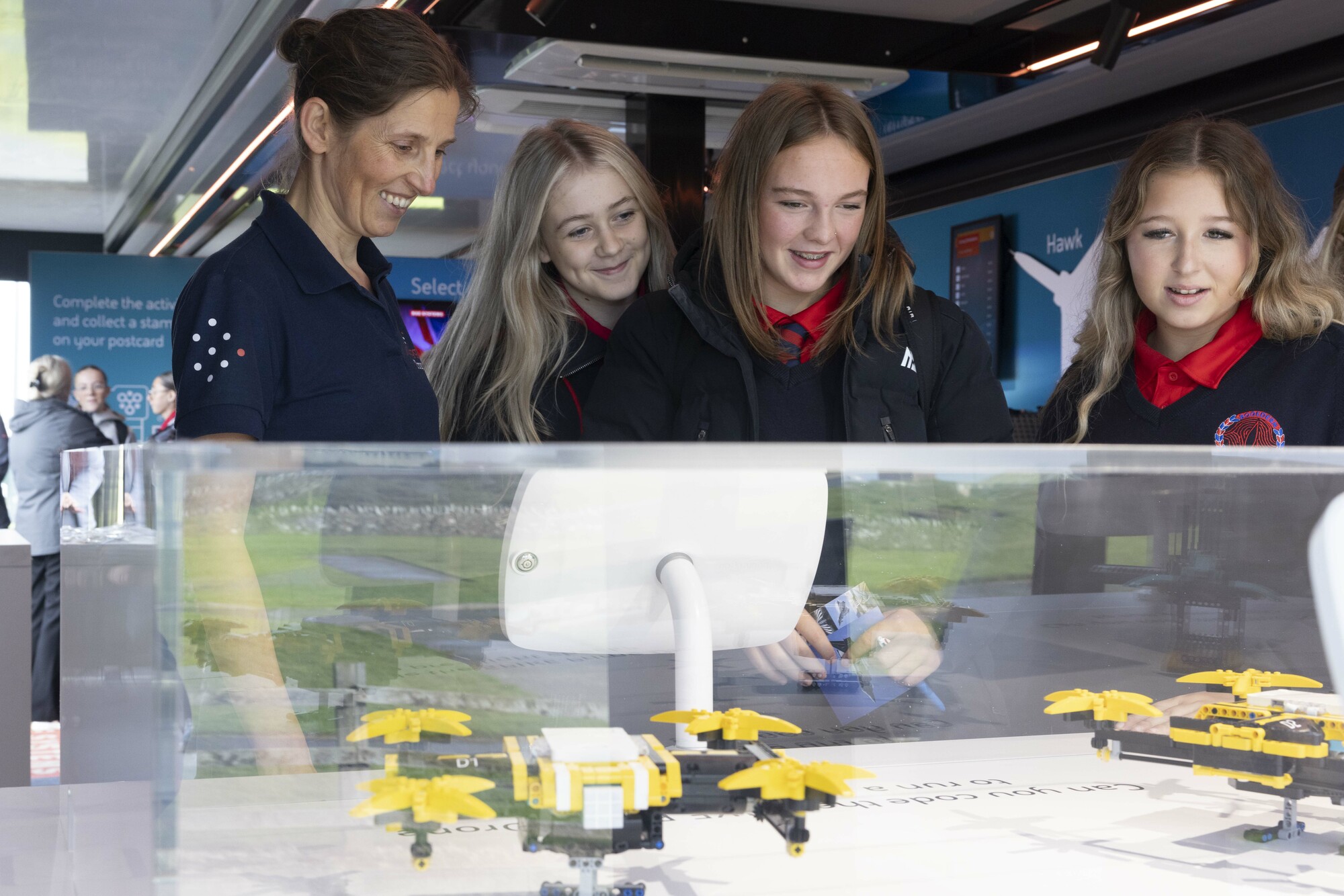 Students visiting a BAE Systems exhibit
